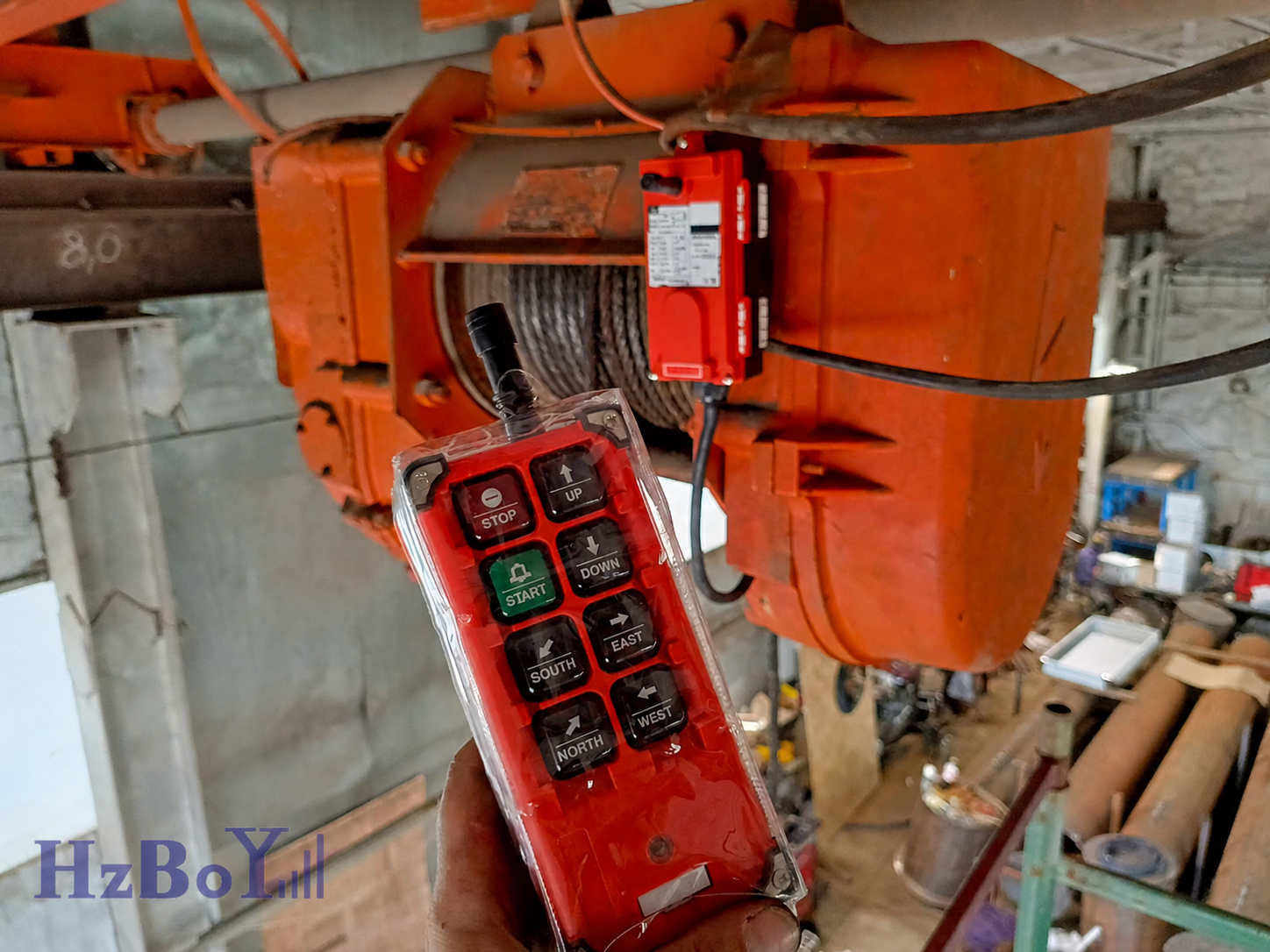 HZBOY industrial wireless remote control used on an electric hoist